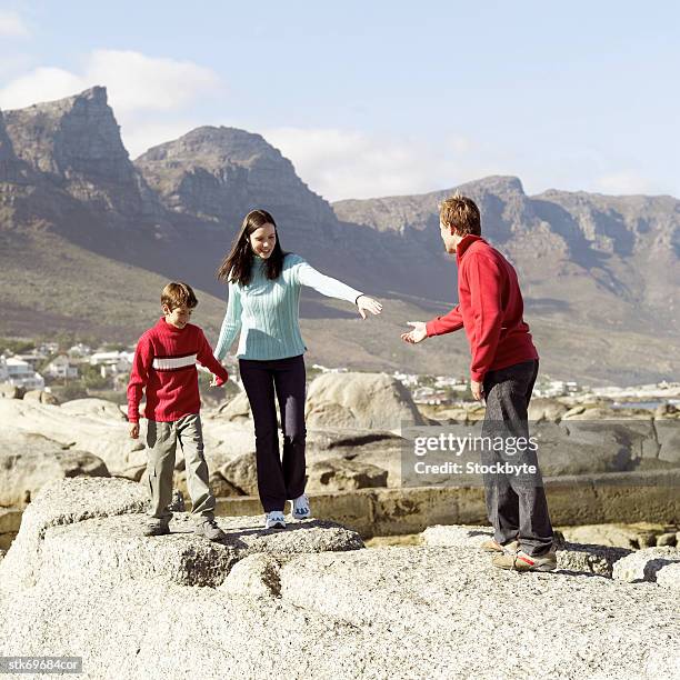 couple with their son (8-9) out walking - get out stock pictures, royalty-free photos & images