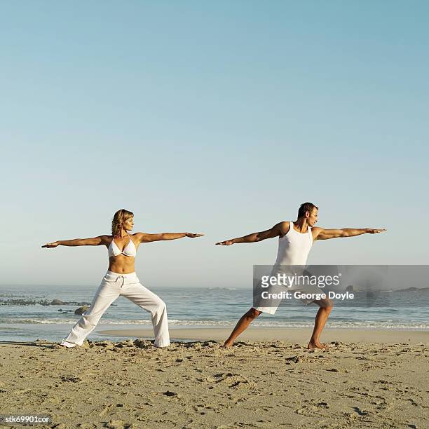 couple working out on the beach - get out stock pictures, royalty-free photos & images