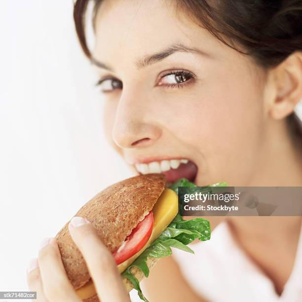 portrait of a woman eating a salad bag - taste of john paul ataker presentation spring 2016 new york fashion week stockfoto's en -beelden