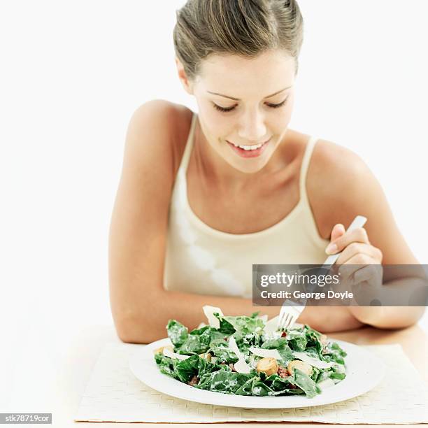 woman eating a waldorf salad - waldorf stock-fotos und bilder