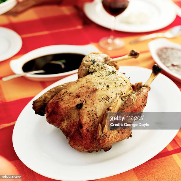 close-up of a roasted chicken served on a table - gen z studio brats premiere of chicken girls arrivals stockfoto's en -beelden