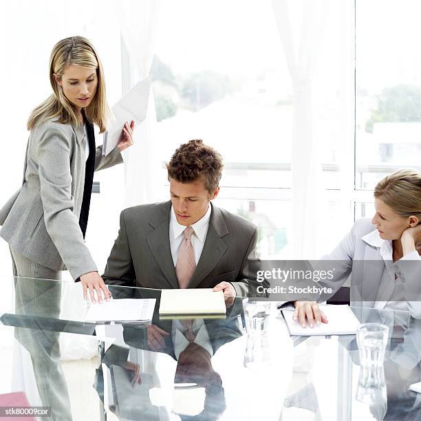 a group of young business executives working in a meeting room - presentation of the book scenes de crime au louvre written by christos markogiannakis in paris stockfoto's en -beelden