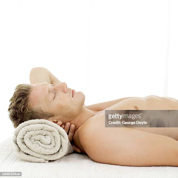 side profile of a young man sleeping with a rolled towel for a pillow - in profile stock pictures, royalty-free photos & images
