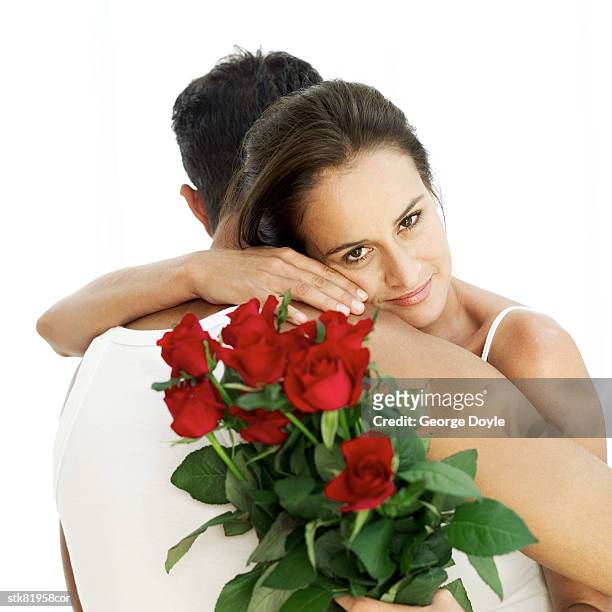 portrait of a young couple hugging - magnoliopsida foto e immagini stock