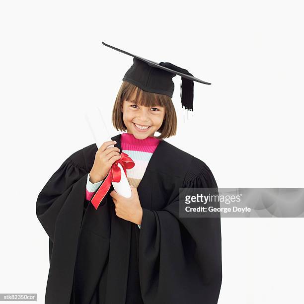 portrait of a girl wearing a graduation outfit holding a degree - national archives foundation honor tom hanks at records of achievement award gala stockfoto's en -beelden