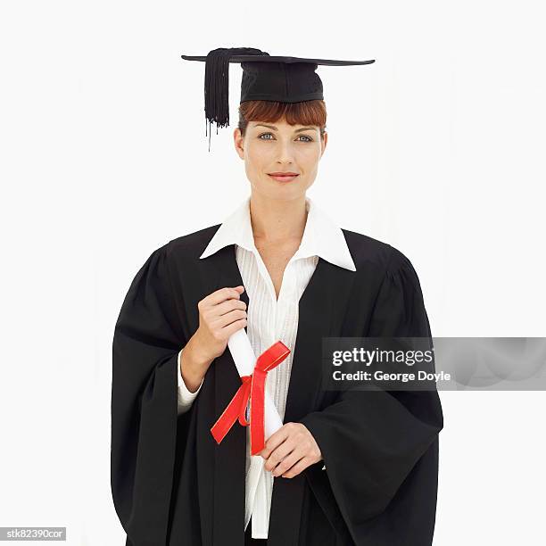 portrait of a woman graduate wearing a robe holding a degree - national archives foundation honor tom hanks at records of achievement award gala stockfoto's en -beelden