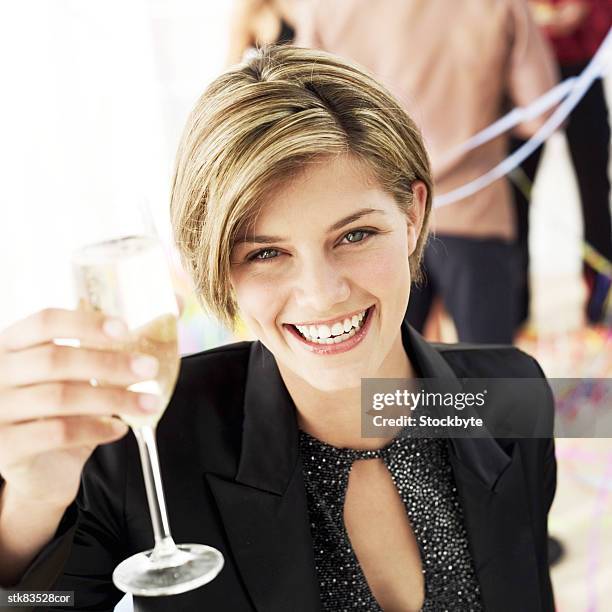 elevated view of a woman holding up a glass of champagne - tokyo governor and leader of the party of hope yuriko koike on the campaign trial for lower house elections stockfoto's en -beelden