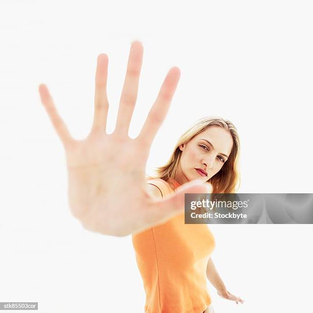 woman with arm outstretched - miembro humano fotografías e imágenes de stock