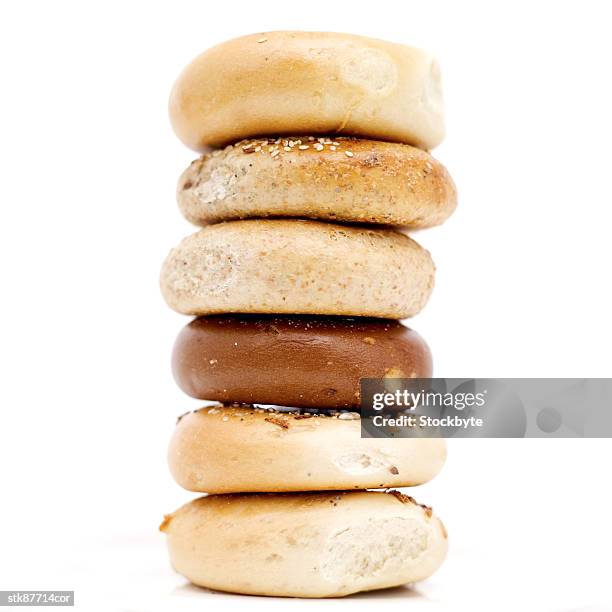 close-up of assorted bagels piled one on top of the other - other stock-fotos und bilder