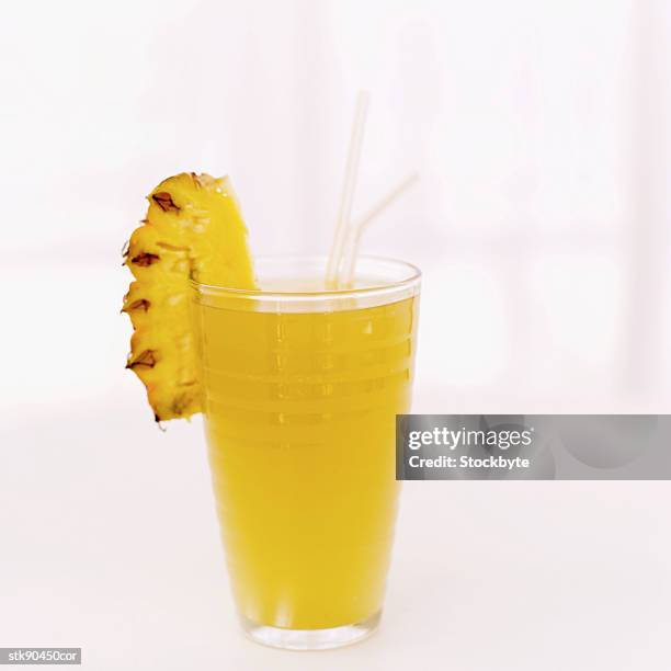 close-up of a glass of pineapple juice - drinks utensil stock pictures, royalty-free photos & images
