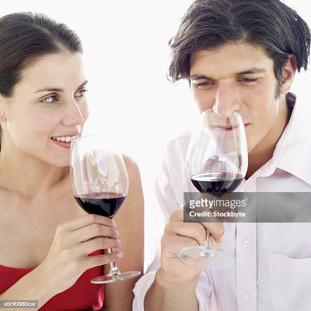close-up of a couple smelling the aroma of red wine - taste of john paul ataker presentation spring 2016 new york fashion week stockfoto's en -beelden