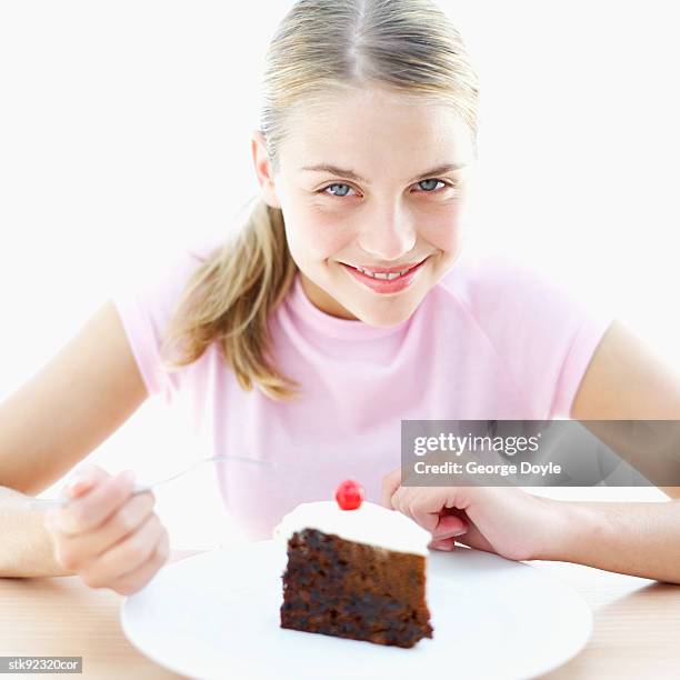 teenage girl (15-16) with a slice of chocolate cake - hungary v denmark 25th ihf mens world championship 2017 round of 16 stockfoto's en -beelden