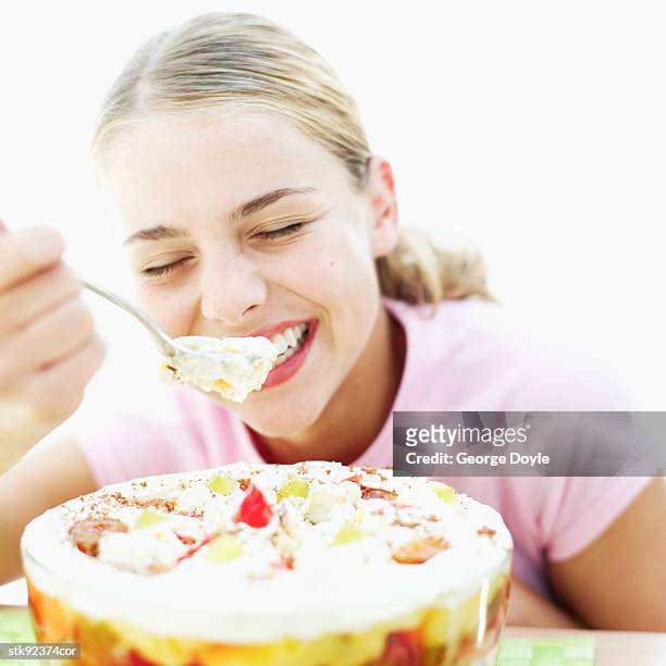 teenage girl (15-16) eating fruit trifle - hungary v denmark 25th ihf mens world championship 2017 round of 16 stockfoto's en -beelden