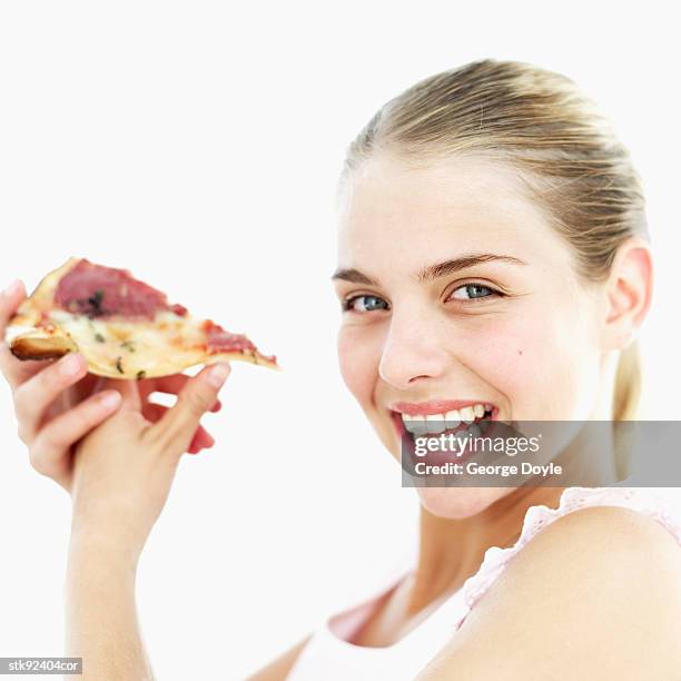 side profile of a teenage girl (15-16) holding up a slice of pizza - hungary v denmark 25th ihf mens world championship 2017 round of 16 stockfoto's en -beelden
