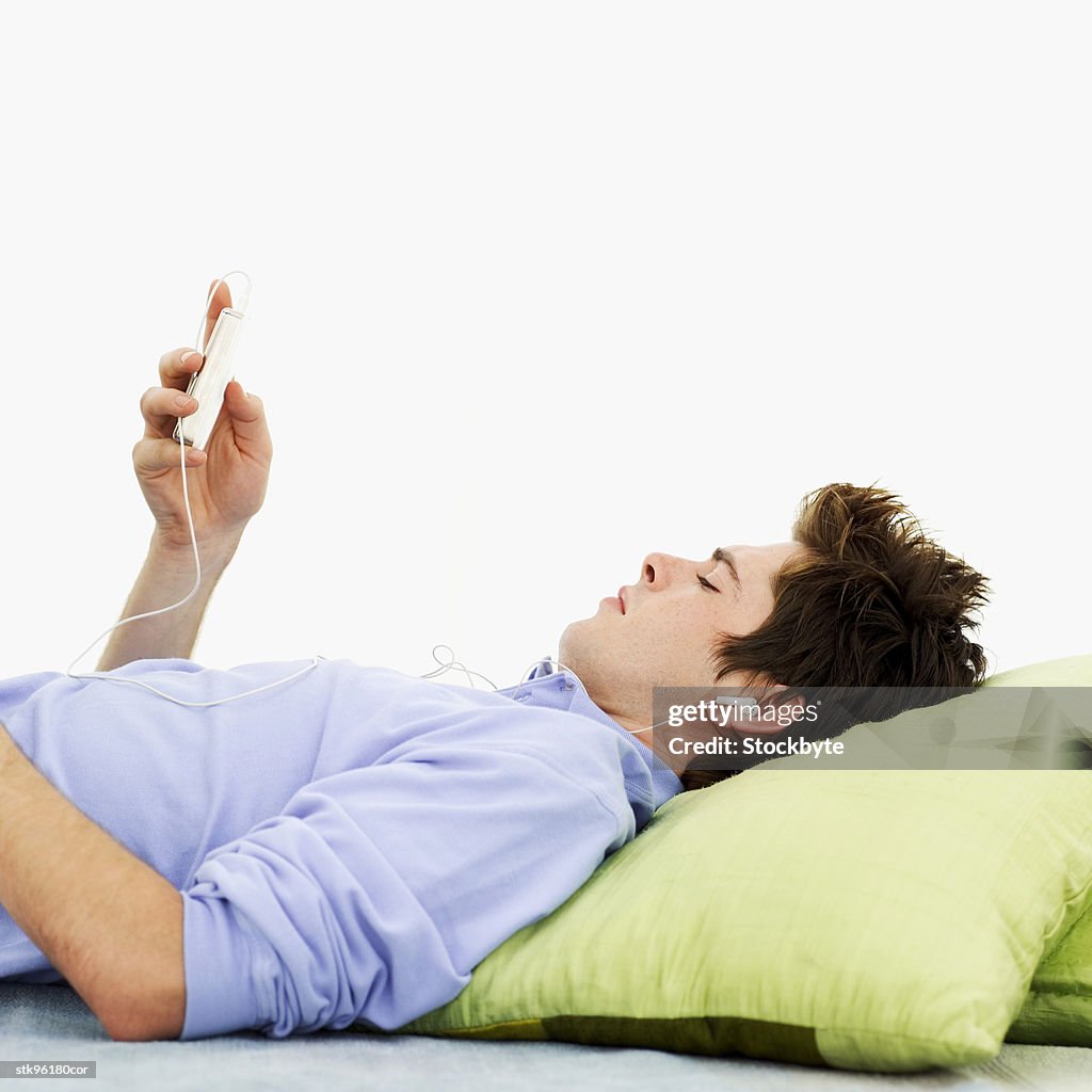Man relaxing with an mp3 player