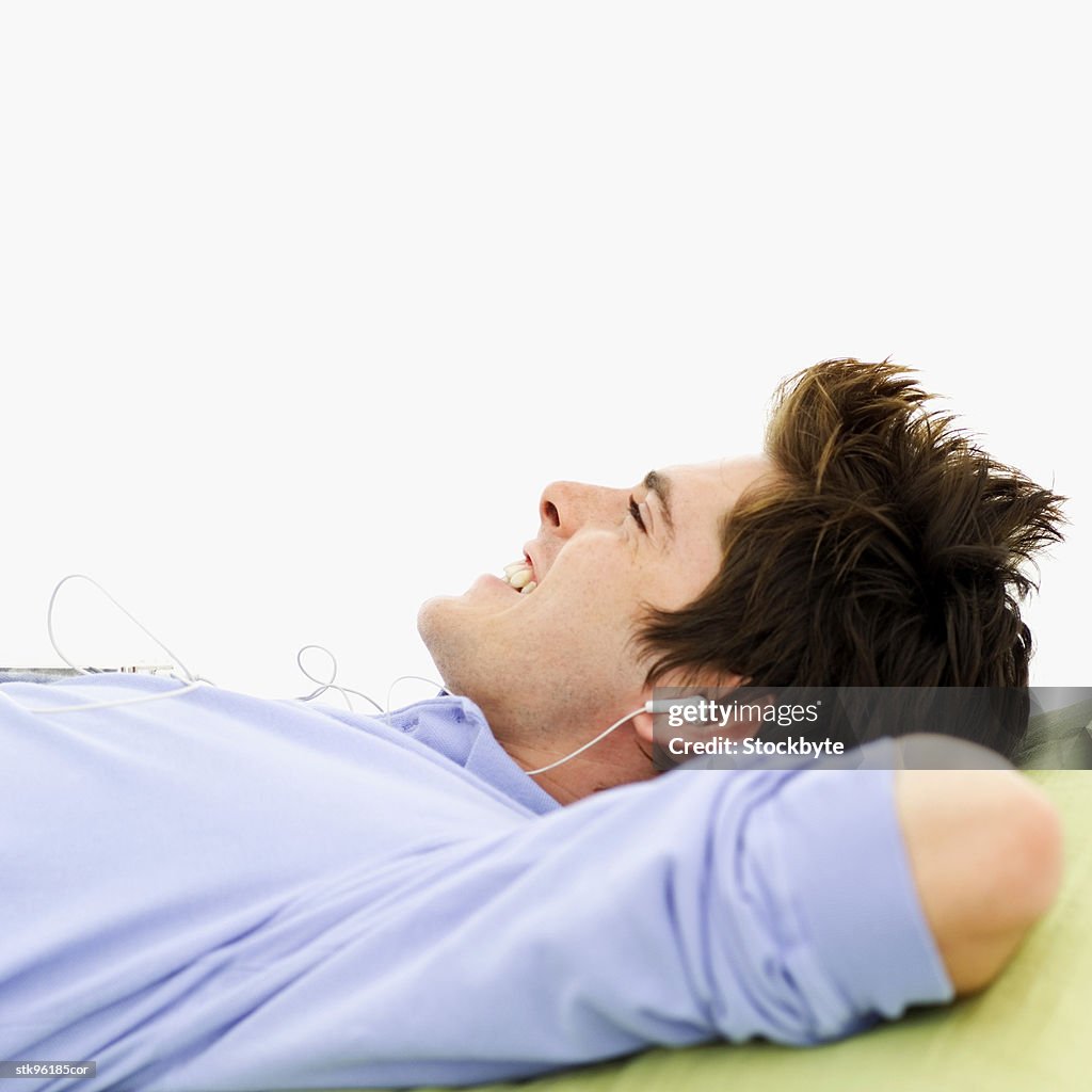 Man relaxing with an mp3 player