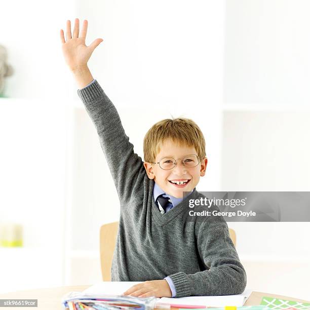 portrait of a young boy (12-15) raising his hand in class - the academy of television arts sciences and sag aftra celebrate the 65th primetime emmy award nominees stockfoto's en -beelden