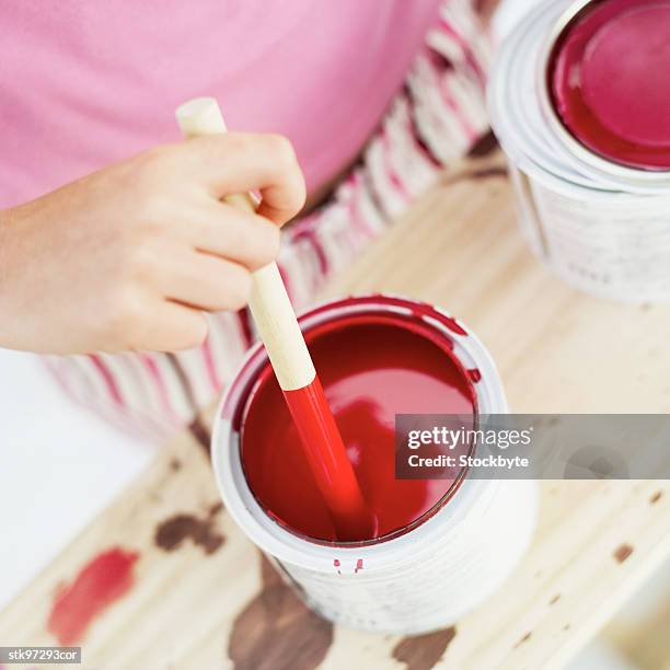 close-up of a hand mixing a bowl of red paint - unknown gender stock pictures, royalty-free photos & images