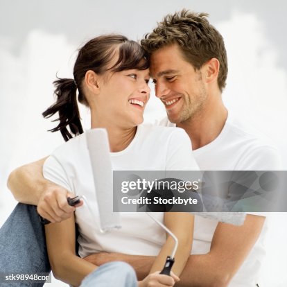 Happy couple doing diy Happy couple doing diy