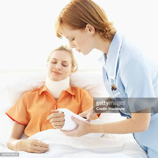 female nurse tending to a woman - cast of amcs low winter sun q a with art house convergence stockfoto's en -beelden