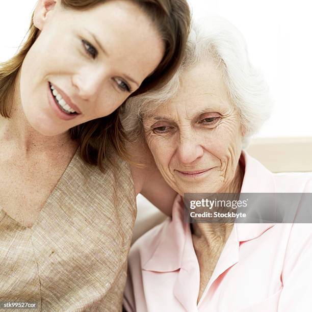 portrait of a young woman and her mother - her stock pictures, royalty-free photos & images