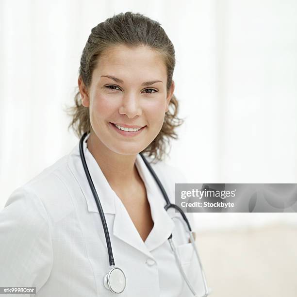 portrait of a female nurse with a stethoscope around her neck - her bildbanksfoton och bilder
