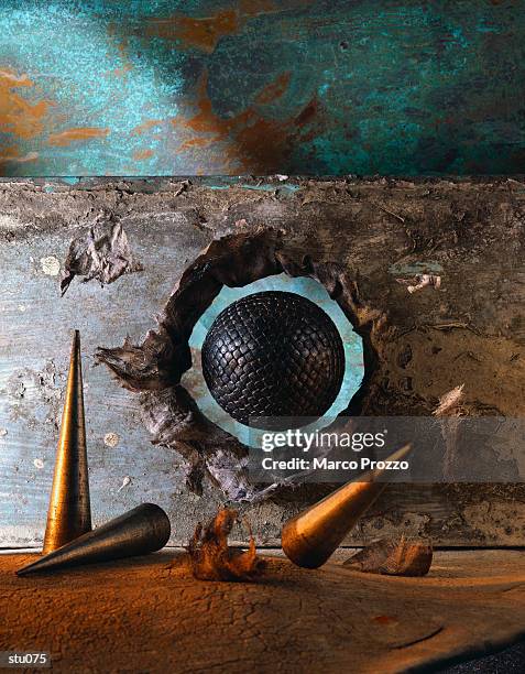 ball bursting through wall - marcao stock pictures, royalty-free photos & images