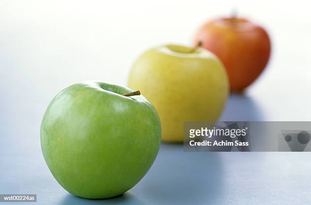 apples in a line, close up - a stock pictures, royalty-free photos & images