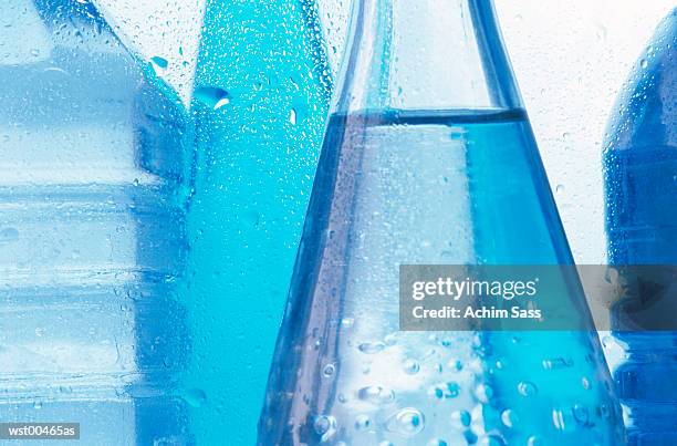 mid section of cold bottled water, close up - estados de agua fotografías e imágenes de stock