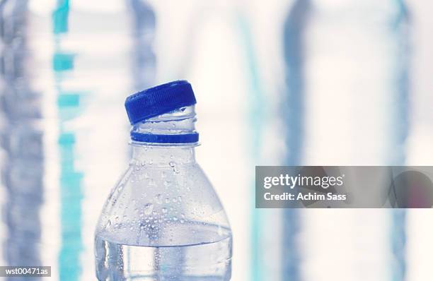 high section of open bottle of water, close up - water form stock pictures, royalty-free photos & images