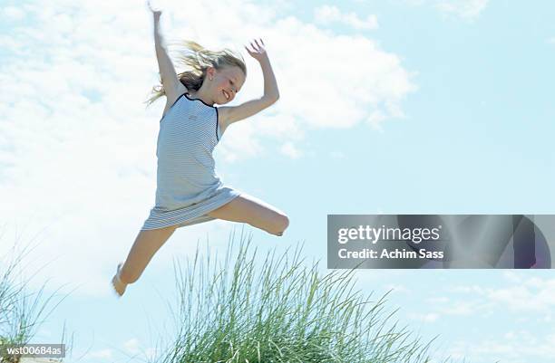 girl mid air - human limb stock pictures, royalty-free photos & images
