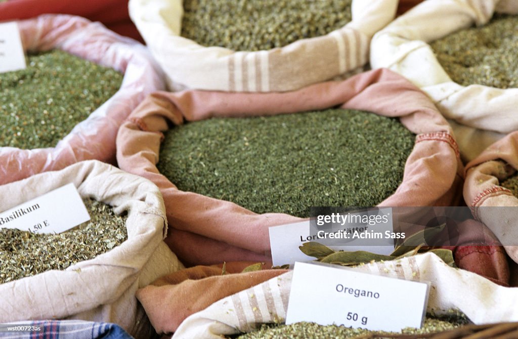 Sacks of dried herbs and spices, close up