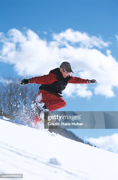 boy snowboarding mid air - human limb stock pictures, royalty-free photos & images