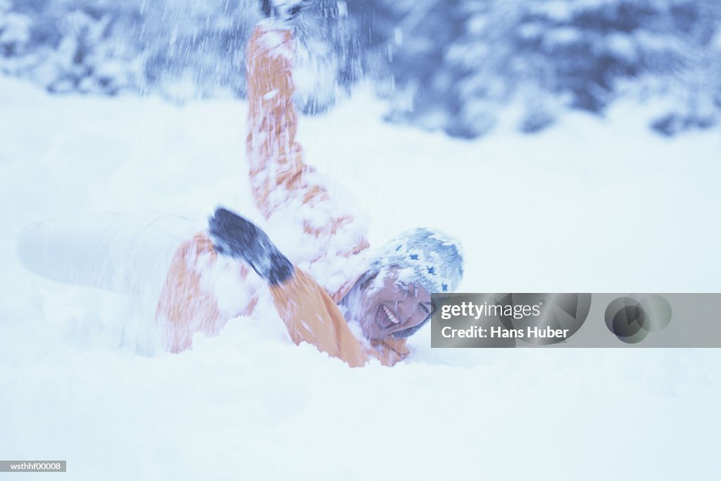 Woman playing in snow