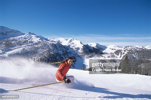 woman skiing on slope - water form stock pictures, royalty-free photos & images