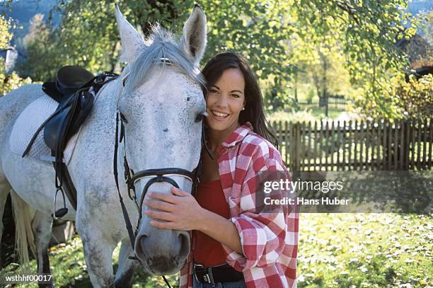 woman standing next to horse - 動物の状態 ストックフォトと画像