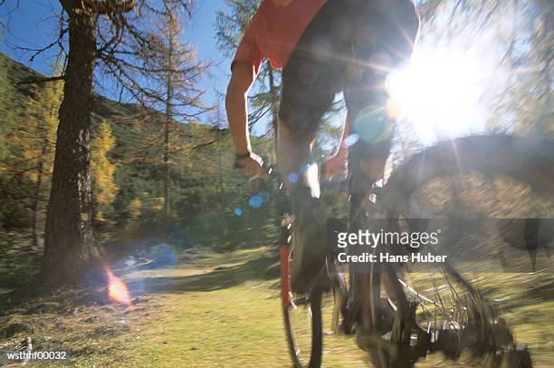 boy riding bicycle, low angle view - thousands of seized guns are melted at the los angeles county sheriffs office annual gun melt stockfoto's en -beelden