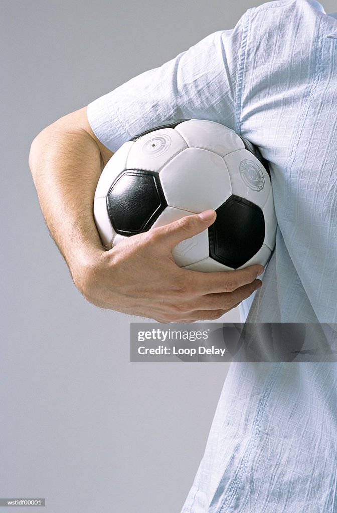 Man holding soccer ball