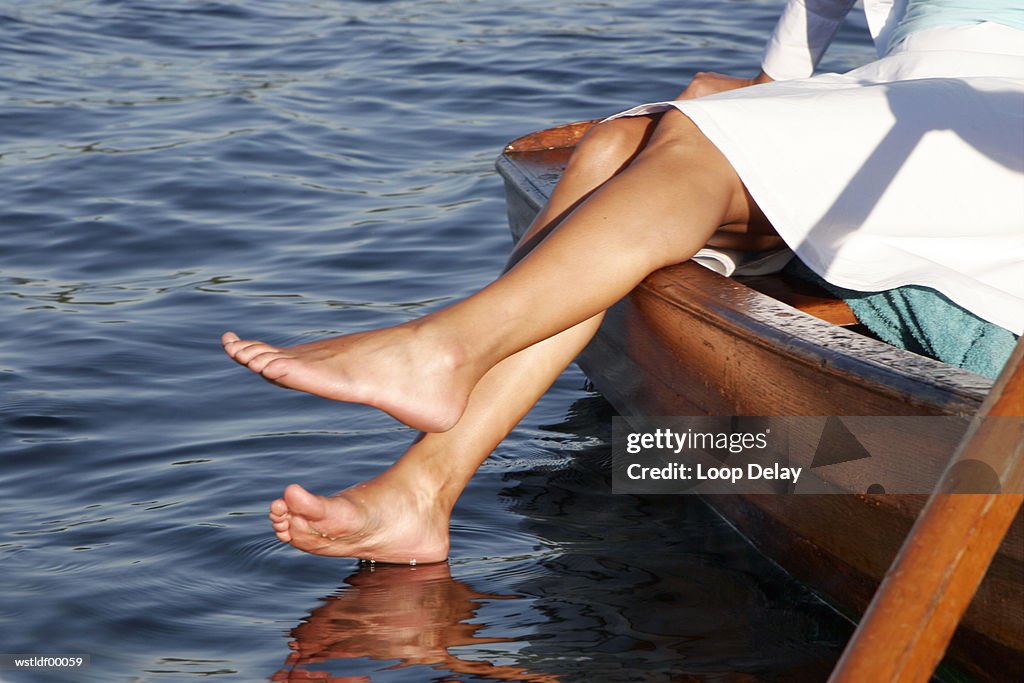 Woman in boat, low section
