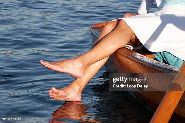 woman in boat, low section - volcano or lava flow or salt terrace or forces of nature or forest or ocean or waves o stock pictures, royalty-free photos & images