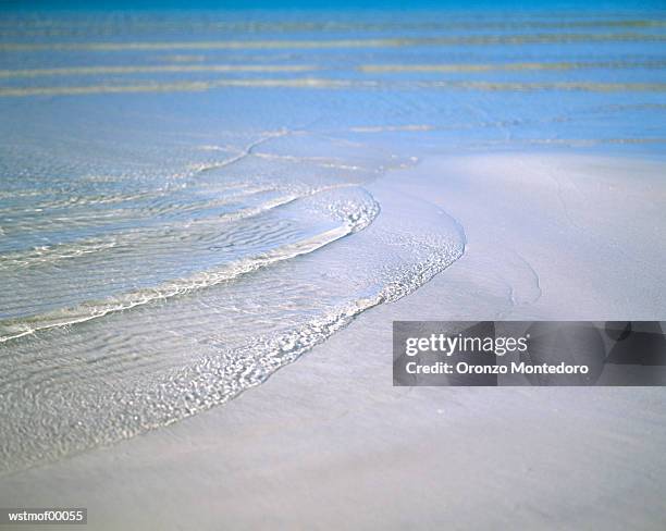 soft waves at the sand beach - volcano or lava flow or salt terrace or forces of nature or forest or ocean or waves o stock pictures, royalty-free photos & images