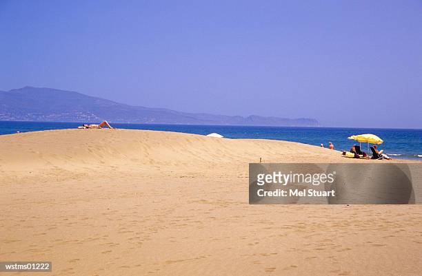 people at platja de sant pere pescador, near roses, costa brava, catalonia, spain - volcano or lava flow or salt terrace or forces of nature or forest or ocean or waves o stock pictures, royalty-free photos & images