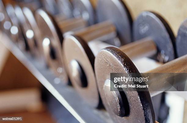 dumbbells in a line, close up - a of stock pictures, royalty-free photos & images