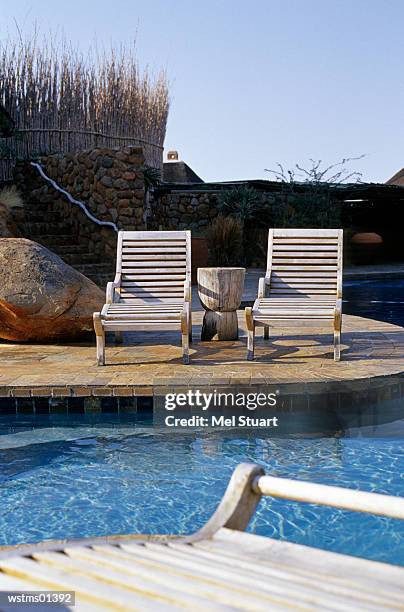 deck chairs by poolside, south africa - texas red carpet screening of hell or high water stock pictures, royalty-free photos & images