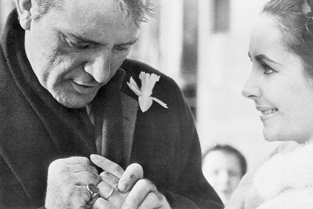 Toronto, Canada: Richard Burton and Elizabeth Taylor display thier wedding rings for Toronto photographer. Married in a secret ceremony in Montreal,...