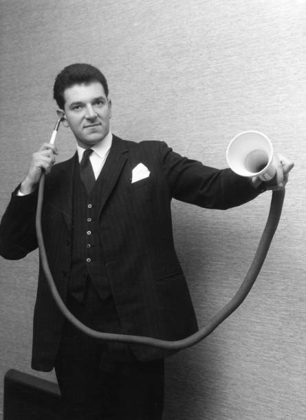 11th-january-1963-a-man-demonstrating-a-long-distance-ear-trumpet-at-picture-id3317613