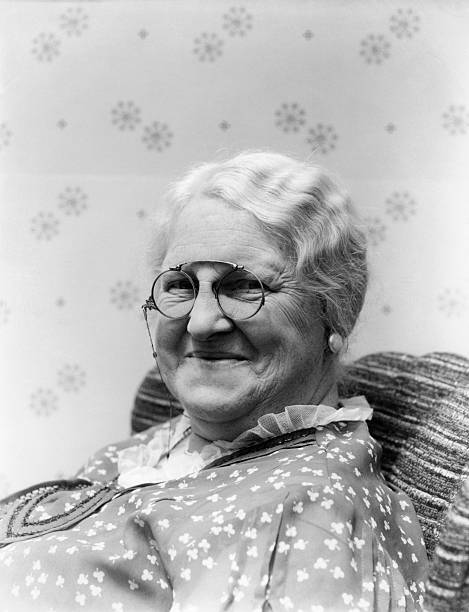 1930s PORTRAIT OF ELDERLY WHITE HAIR WOMAN SMILING WEARING PINCE-NEZ GLASSES