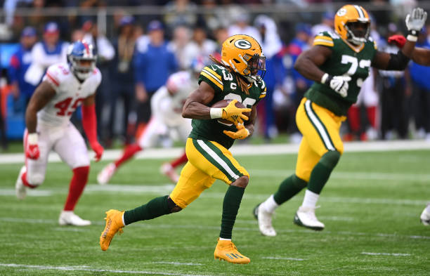 Aaron Jones of the Green Bay Packers rushes during the NFL match between New York Giants and Green Bay Packers at Tottenham Hotspur Stadium on...