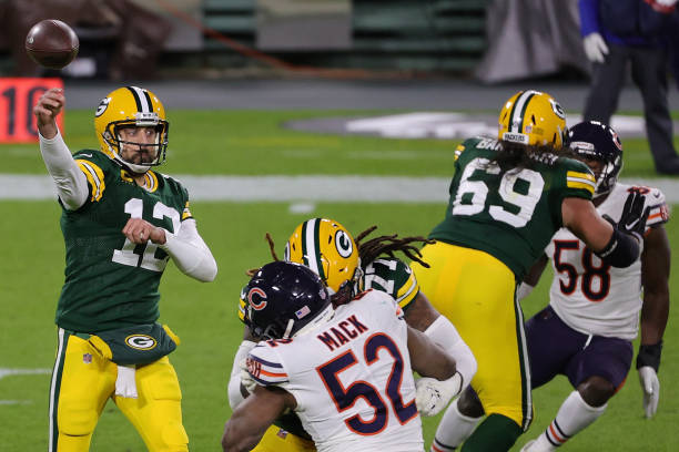 Aaron Rodgers of the Green Bay Packers drops back to pass during a game against the Chicago Bears at Lambeau Field on November 29, 2020 in Green Bay,...