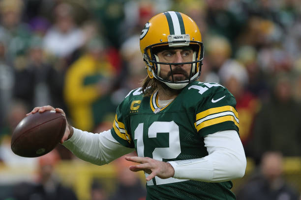 Aaron Rodgers of the Green Bay Packers drops back to pass during a game against the Cleveland Browns at Lambeau Field on December 25, 2021 in Green...